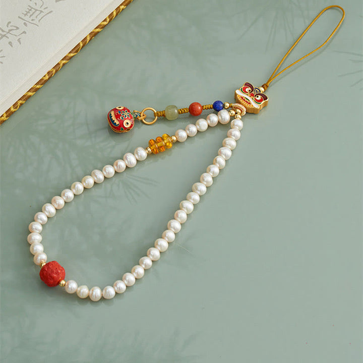 Buddha Stones Perla naturale Cinabro Borsa per soldi Campana Oro Bestia che deglutisce Leone danzante Guarigione Telefono Decorazione appesa