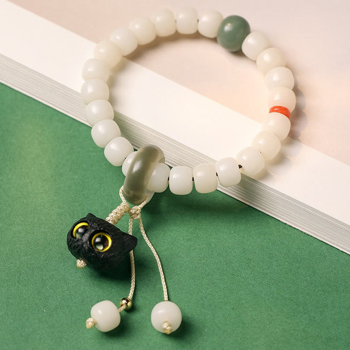 Buddha Stones Semi di Bodhi naturali Legno nero africano Bellissimo ciondolo a forma di gatto Braccialetto di pace e armonia - image 2