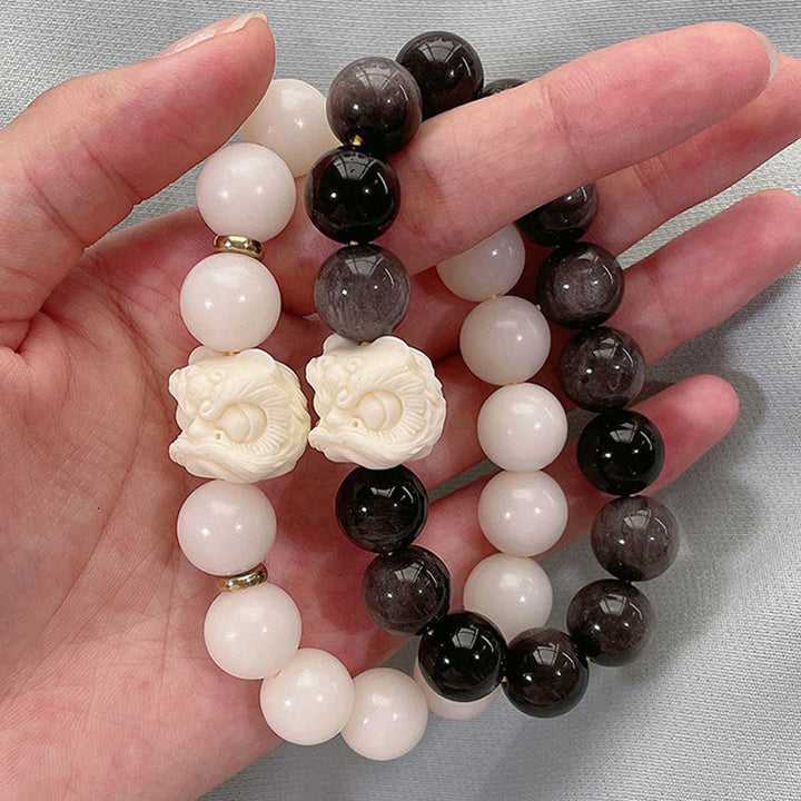 Braccialetto di protezione con leone danzante , Buddha Stones di avorio, seme di Bodhi, pietre di Buddha, argento lucido e ossidiana