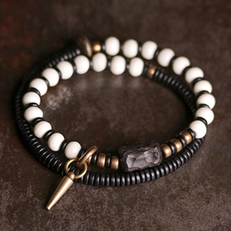 Braccialetto di coppia con perline di osso, ebano, Buddha Stones e rame