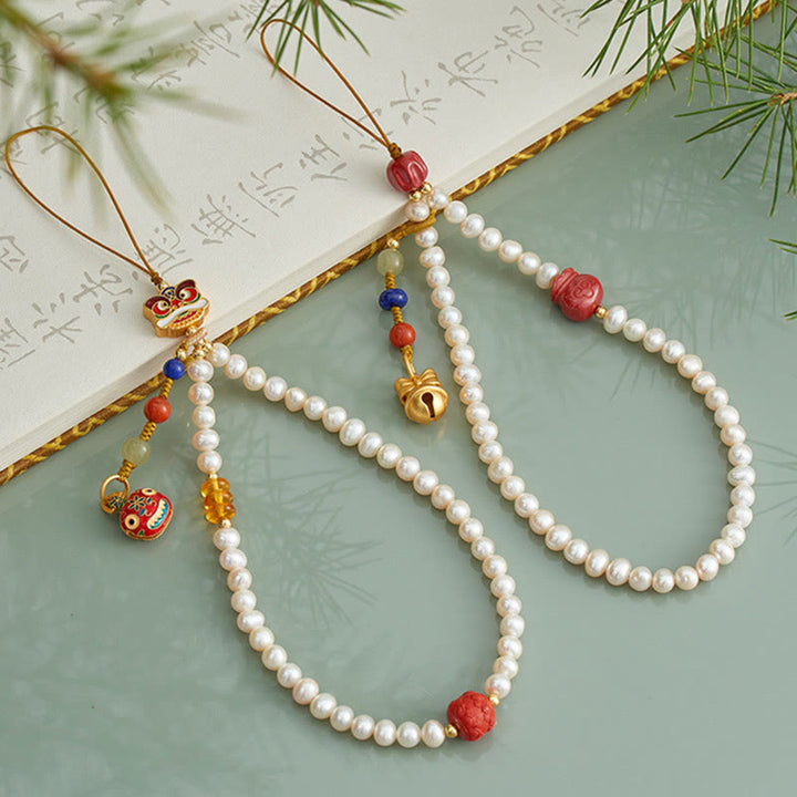 Buddha Stones Perla naturale Cinabro Borsa per soldi Campana Oro Bestia che deglutisce Leone danzante Guarigione Telefono Decorazione appesa