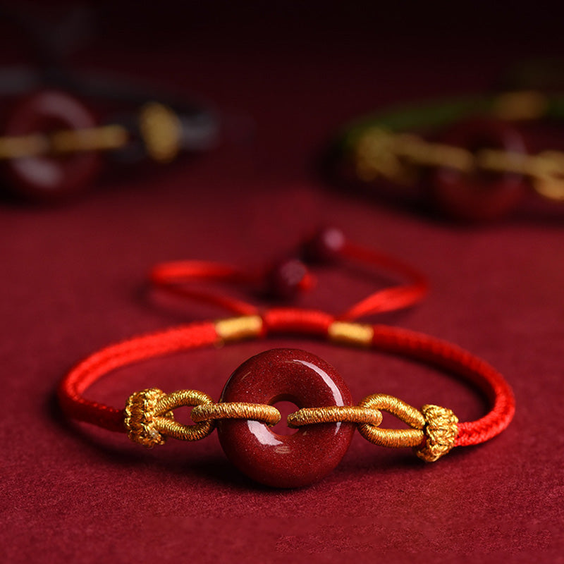 Bracciale intrecciato con motivo a fibbia per la pace in cinabro lavorato a mano Buddha Stones