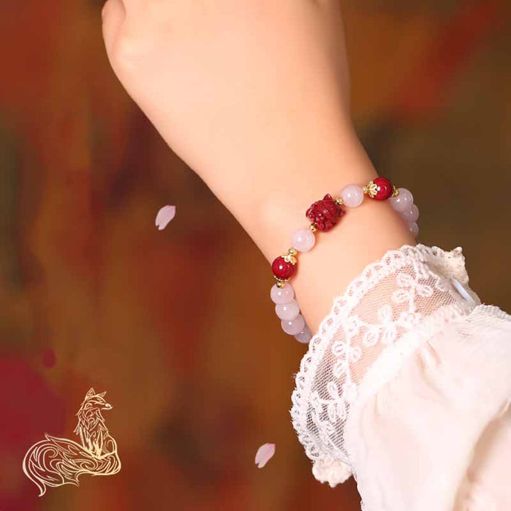 Braccialetto dell'amore con volpe a nove code in cristallo rosa naturale Buddha Stones Cinnabar