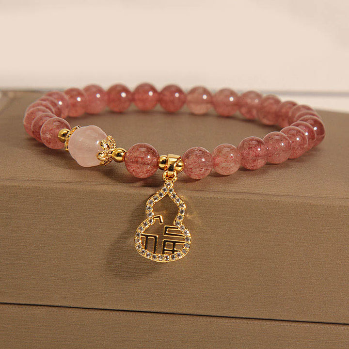 Braccialetto positivo con ciondolo a forma di carattere Fu di zucca e quarzo fragola Buddha Stones