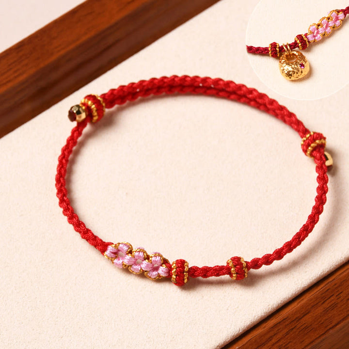 Braccialetto di corda intrecciata con protezione in fiore di pesco fatto a mano Buddha Stones