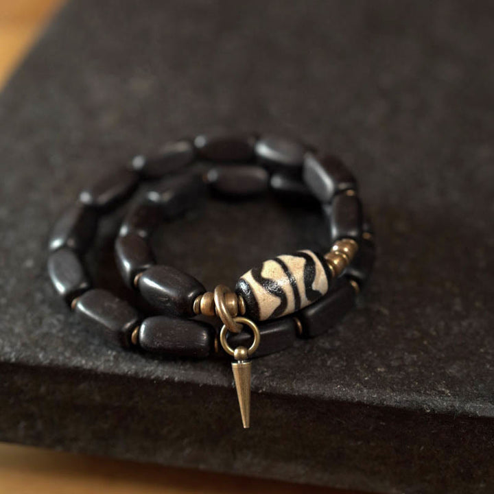 Braccialetto doppio giro in rame con perline di legno di Buddha Stones del Tibet Dzi