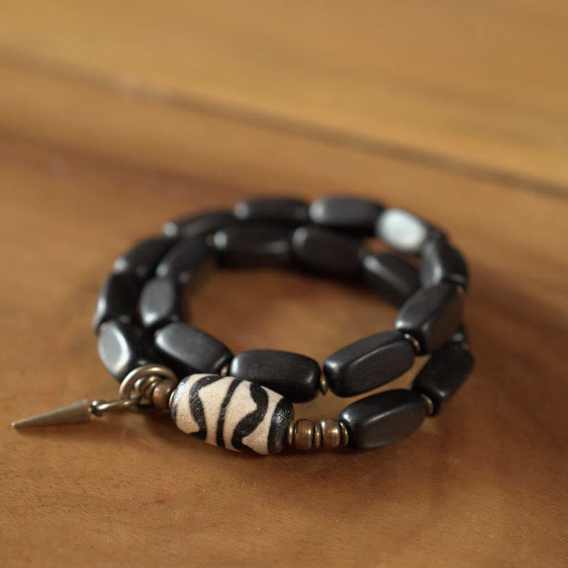 Braccialetto doppio giro in rame con perline di legno di Buddha Stones del Tibet Dzi