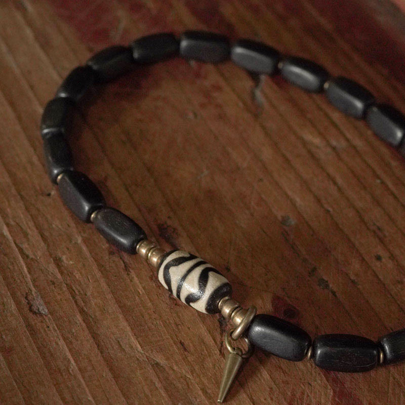 Braccialetto doppio giro in rame con perline di legno di Buddha Stones del Tibet Dzi