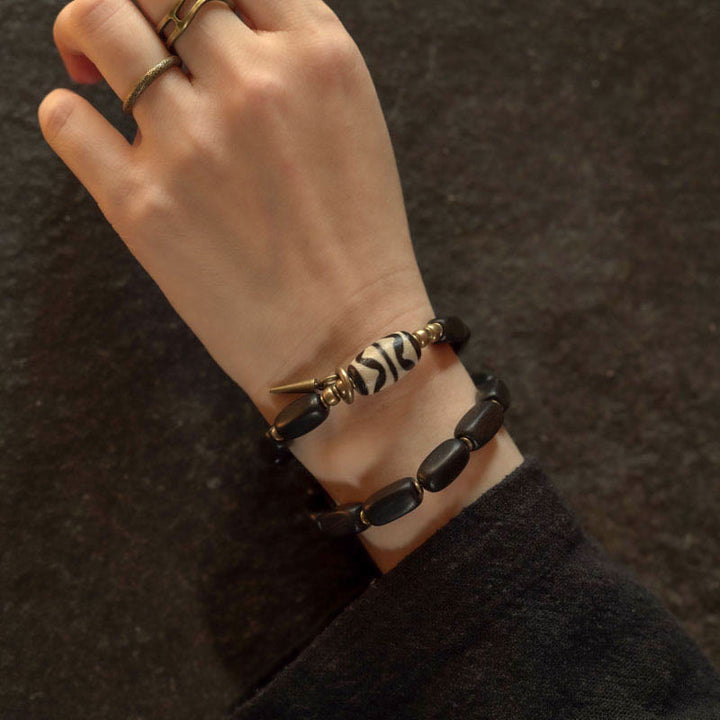 Braccialetto doppio giro in rame con perline di legno di Buddha Stones del Tibet Dzi