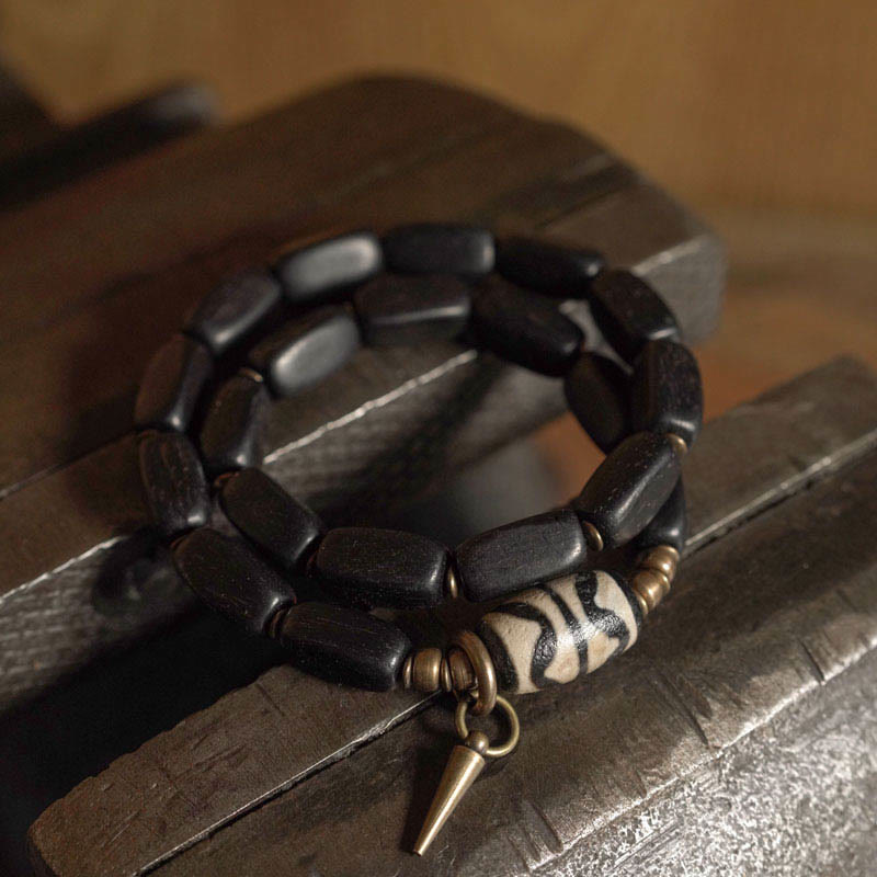 Braccialetto doppio giro in rame con perline di legno di Buddha Stones del Tibet Dzi