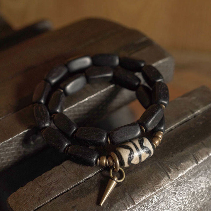 Braccialetto doppio giro in rame con perline di legno di Buddha Stones del Tibet Dzi