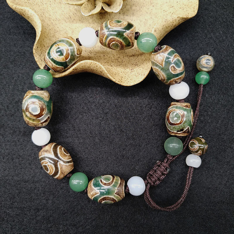 Braccialetto intrecciato con Buddha Stones Dzi tibetane a tre occhi e protezione dalla fortuna