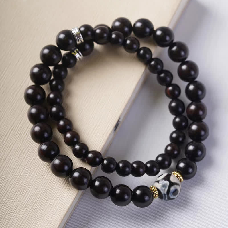 Braccialetto doppio giro in perline di legno di ebano del Tibet Dzi Buddha Stones