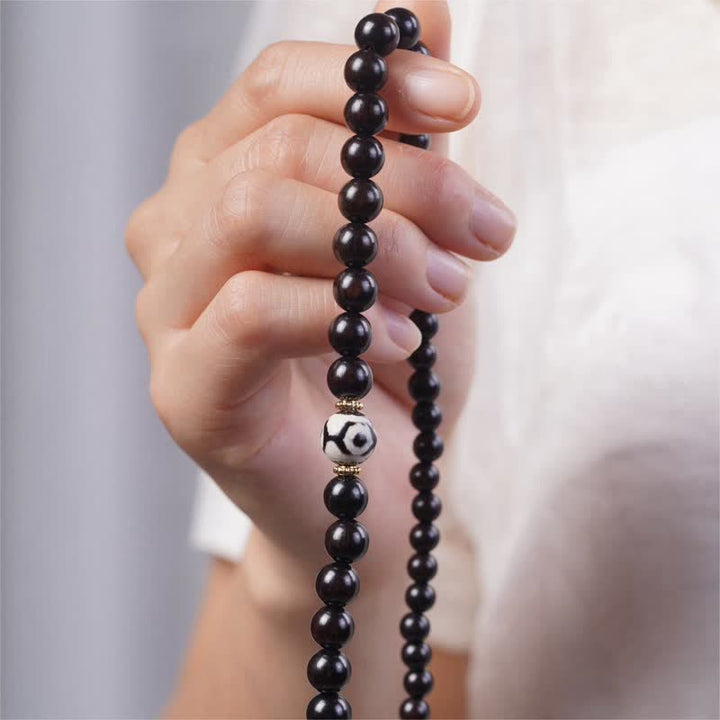 Braccialetto doppio giro in perline di legno di ebano del Tibet Dzi Buddha Stones