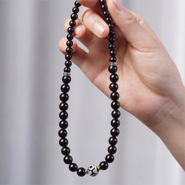 Braccialetto doppio giro in perline di legno di ebano del Tibet Dzi Buddha Stones