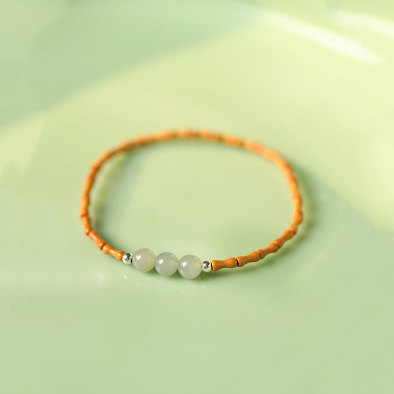 Buddha Stones Braccialetto portafortuna con perline di giada Hetian con motivo in bambù e noccioli di oliva naturali