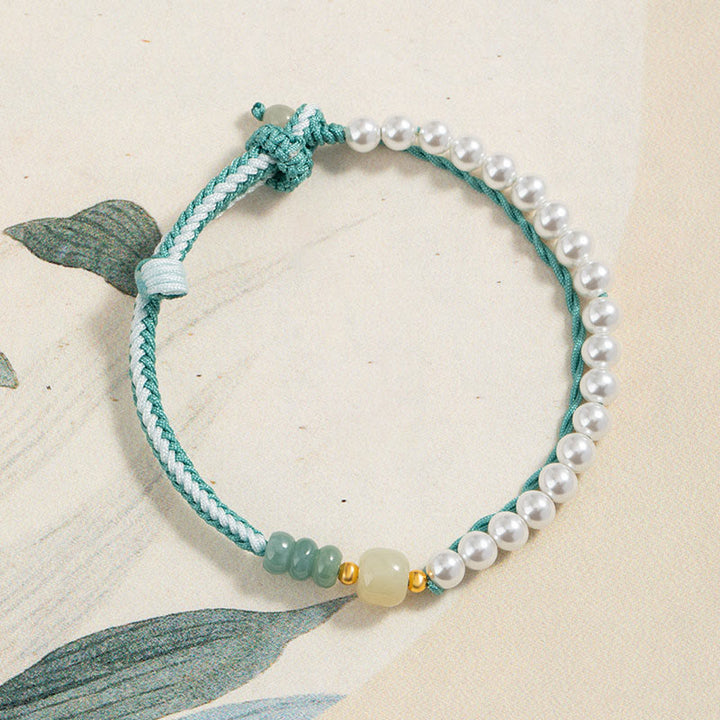 Bracciale Buddha Stones in argento sterling 925 con giada Hetian e corda intrecciata con perle e abbondanza