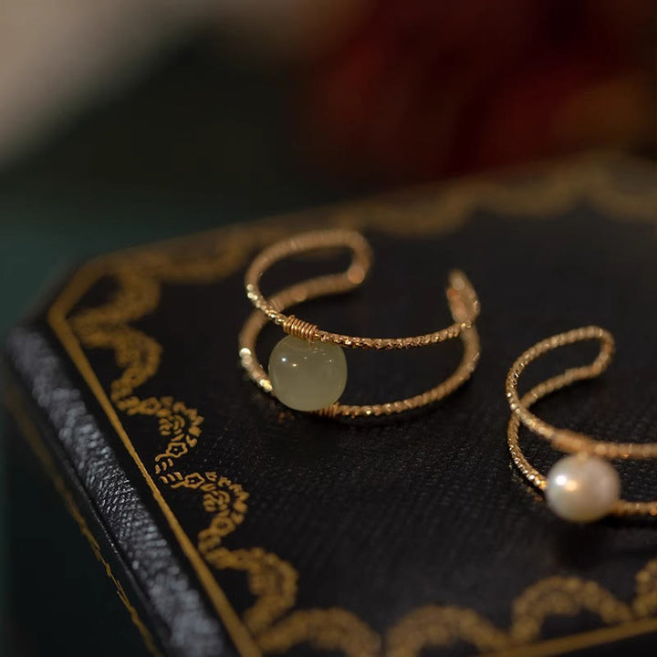 Anello regolabile con perle di giada rotonde in Buddha Stones e doppio strato di rame