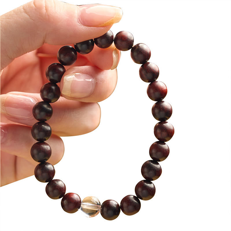 Braccialetto di protezione con piccole foglie di sandalo rosso e cristallo bianco Buddha Stones