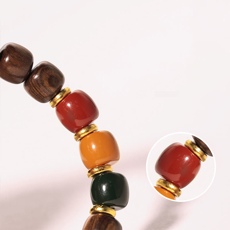 Braccialetto Buddha Stones in legno di ebano e palissandro per l'equilibrio della pace