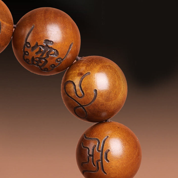 Buddha Stones Fulmine Colpito Legno di Giuggiola Yin Yang Bagua Taoista Tabù Scrittura Simbolo Braccialetto della Fortuna Inciso