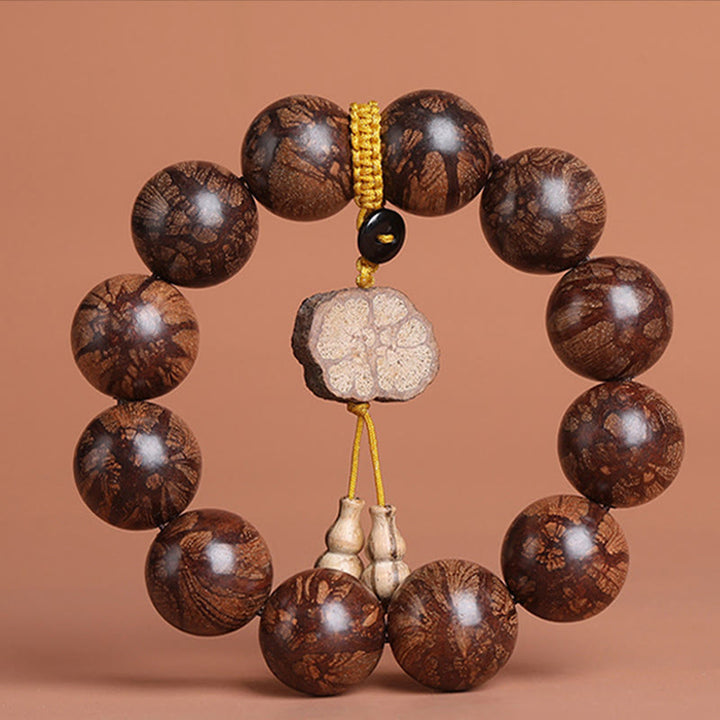 Bracciale Buddha Stones Plum Blossom Wood per la pace interiore