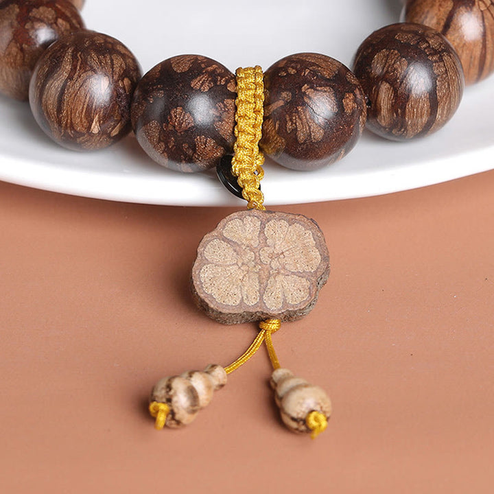 Bracciale Buddha Stones Plum Blossom Wood per la pace interiore