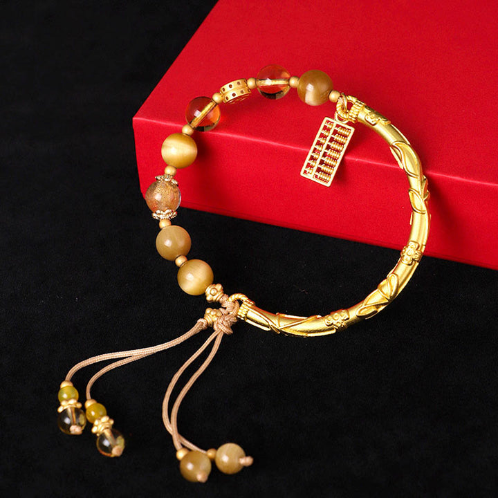 Braccialetto di protezione con ciondolo abaco in occhio di tigre naturale e citrino Buddha Stones