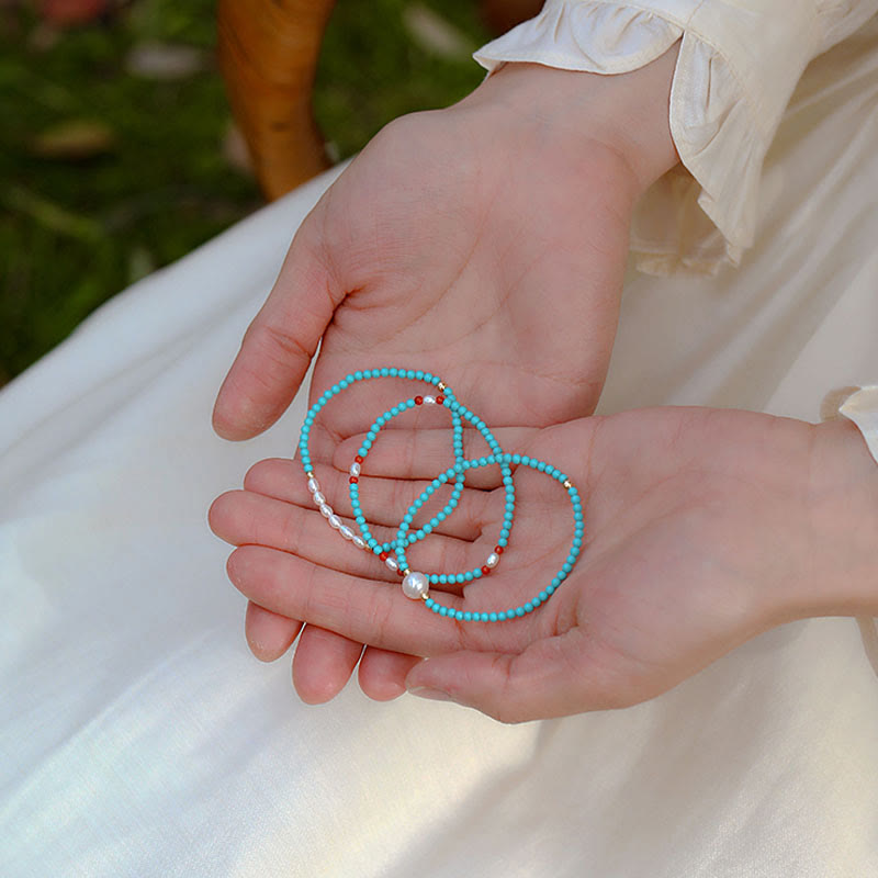 Braccialetto di protezione con piccole perle di agata rossa e turchese Buddha Stones