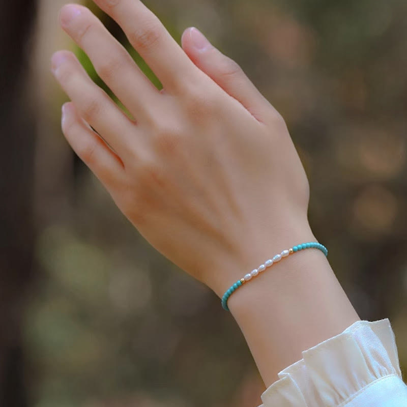 Braccialetto di protezione con piccole perle di agata rossa e turchese Buddha Stones