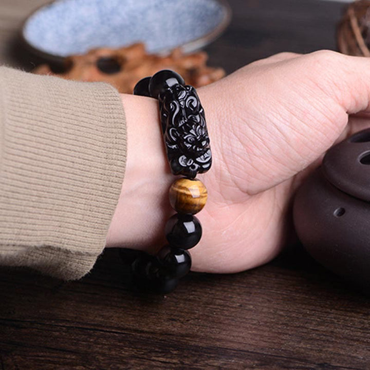 Braccialetto Buddha Stones in ossidiana nera naturale PiXiu Tiger's Eye Strength