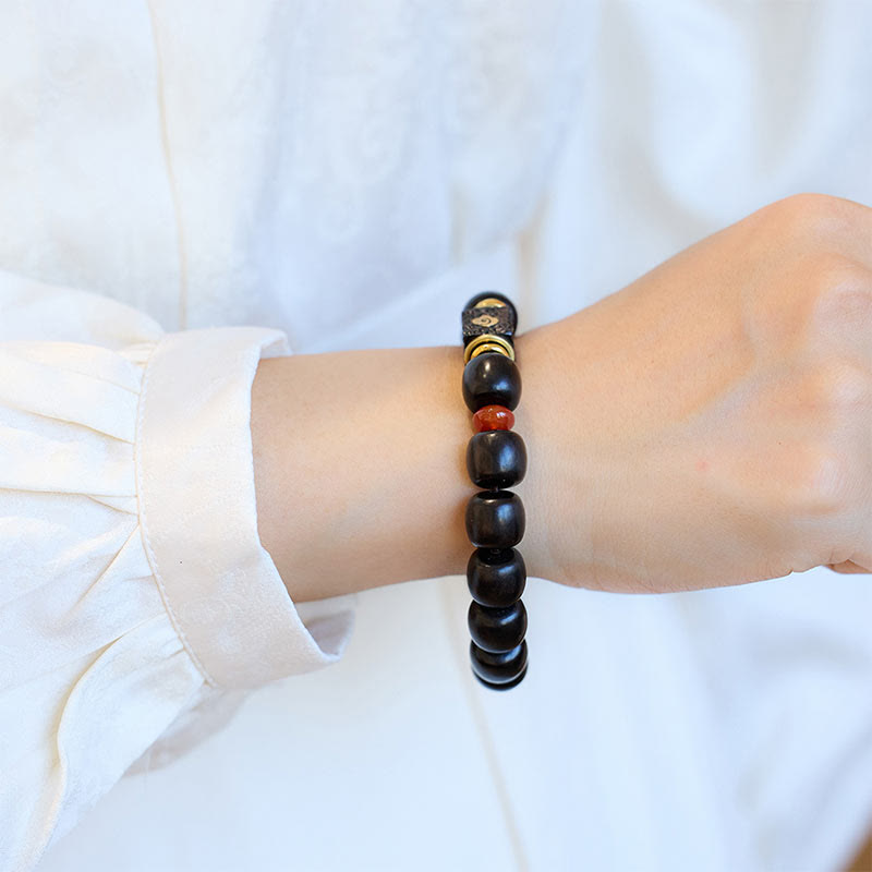 Braccialetto in legno di ebano Buddha Stones e nuvole di buon auspicio incise e calme