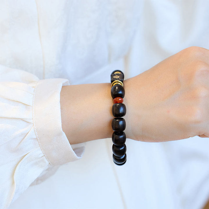 Braccialetto in legno di ebano Buddha Stones e nuvole di buon auspicio incise e calme