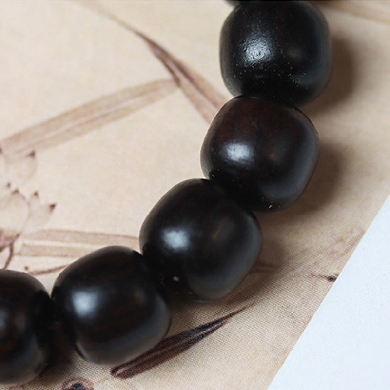 Braccialetto in legno di ebano Buddha Stones e nuvole di buon auspicio incise e calme