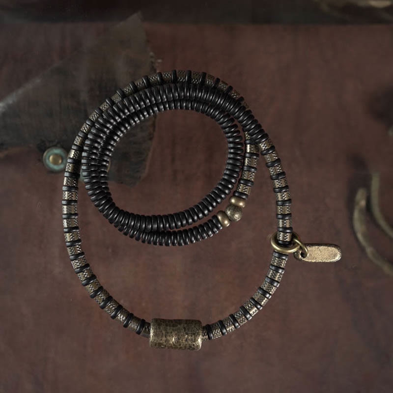 Braccialetto multistrato in rame con perline di legno di ebano tibetano e Buddha Stones