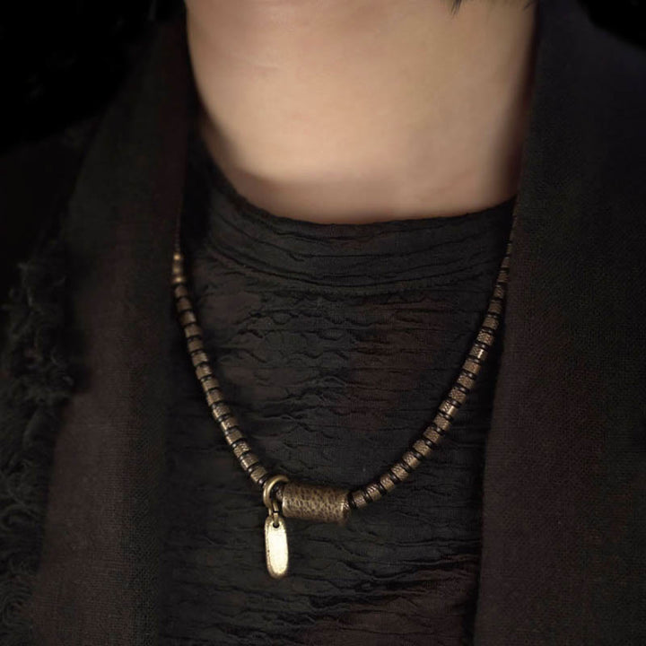 Braccialetto multistrato in rame con perline di legno di ebano tibetano e Buddha Stones