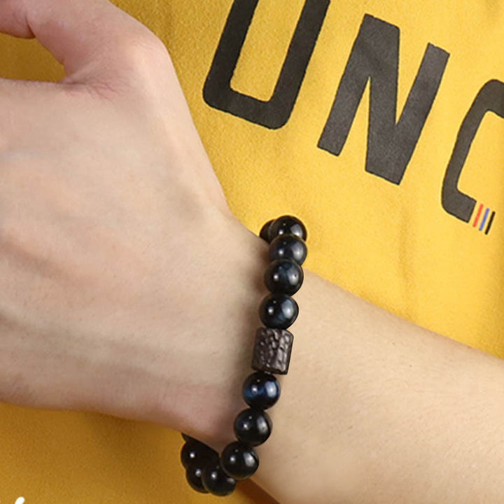 Braccialetto di perline di legno di ebano con occhio di tigre e Buddha Stones