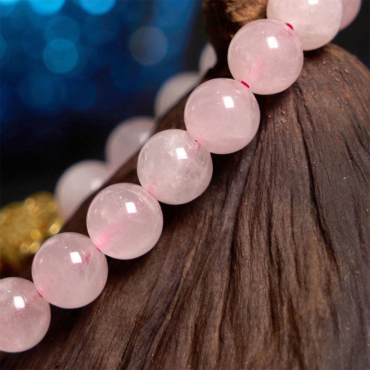 Braccialetto Buddha Stones con fiore di citrino e cristallo rosa