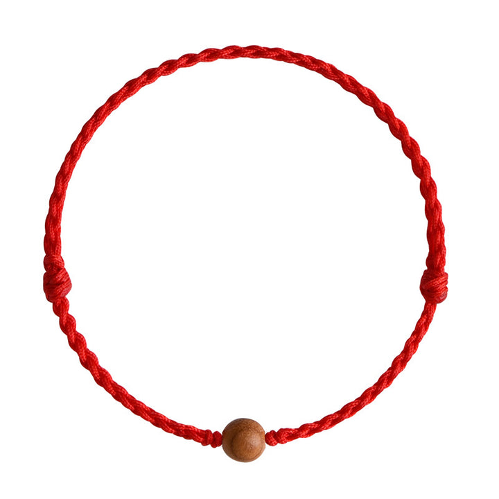 Bracciale intrecciato con perline di legno di pesca naturale Buddha Stones che allontanano gli spiriti maligni