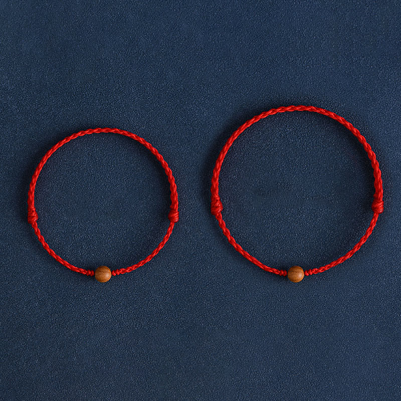 Bracciale intrecciato con perline di legno di pesca naturale Buddha Stones che allontanano gli spiriti maligni