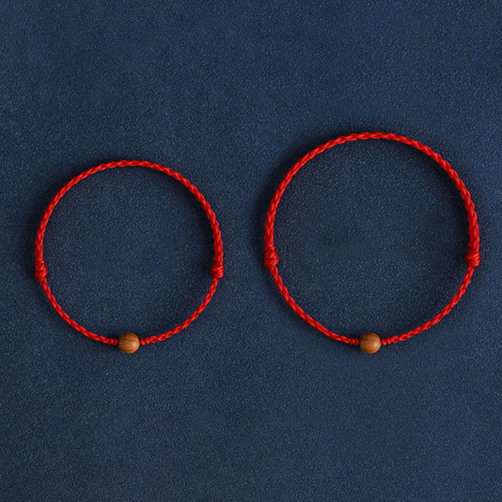 Bracciale intrecciato con perline di legno di pesca naturale Buddha Stones che allontanano gli spiriti maligni