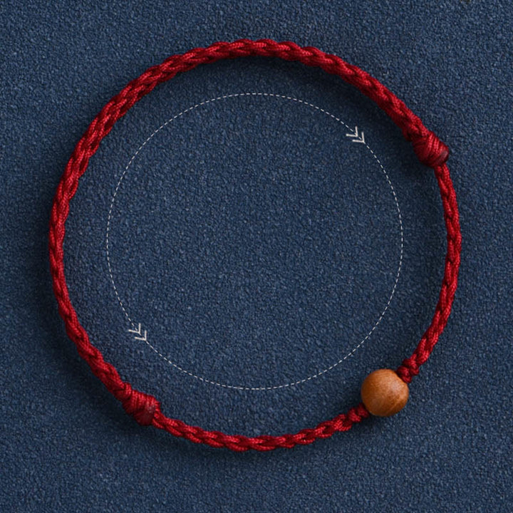 Bracciale intrecciato con perline di legno di pesca naturale Buddha Stones che allontanano gli spiriti maligni