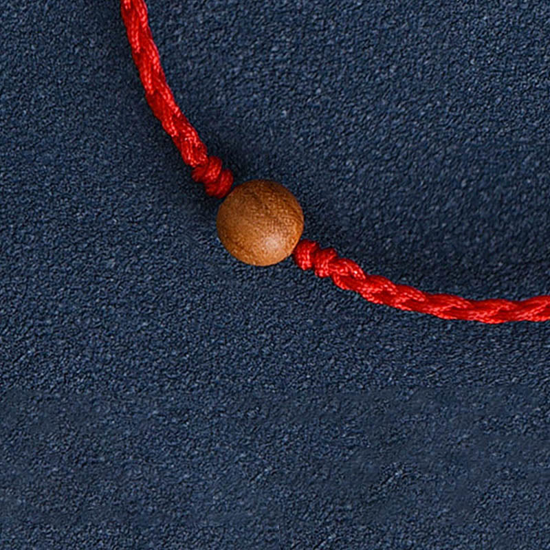Bracciale intrecciato con perline di legno di pesca naturale Buddha Stones che allontanano gli spiriti maligni