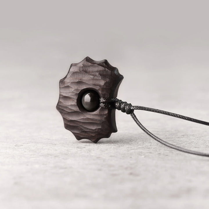 Collana pendente Buddha Stones in legno di ebano e ossidiana di forma irregolare, pace e calma