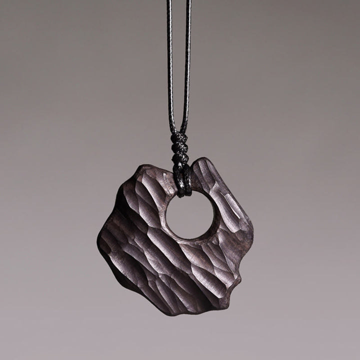 Collana pendente con ciondolo in legno di ebano e forma irregolare cava in Buddha Stones , equilibrio della pace