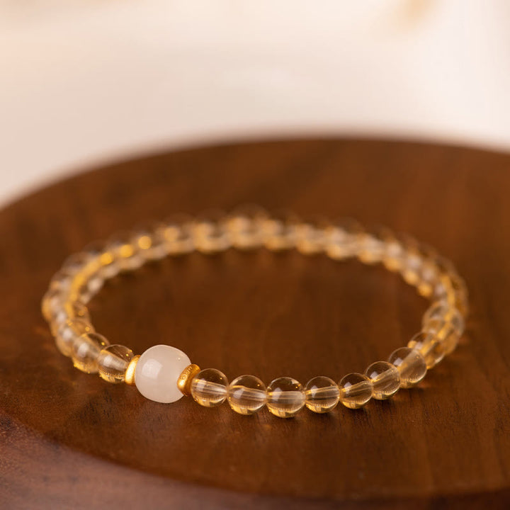 Braccialetto della prosperità con piccole perle di giada citrina e Buddha Stones
