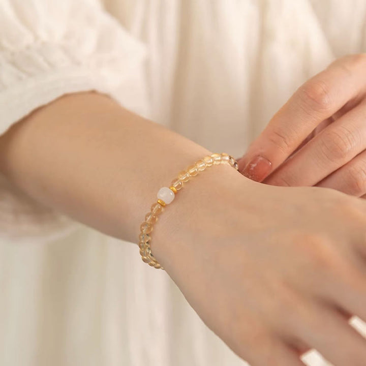 Braccialetto della prosperità con piccole perle di giada citrina e Buddha Stones