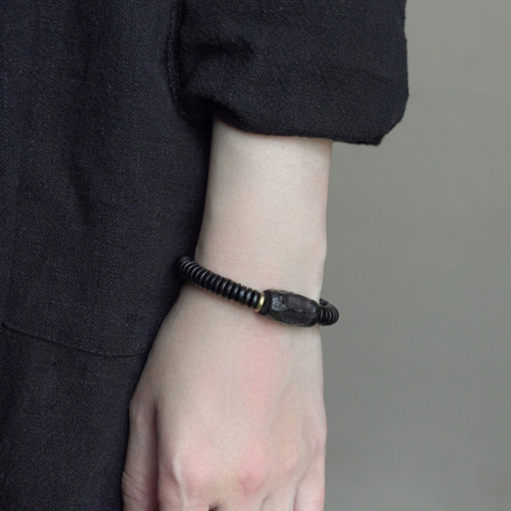 Bracciale Buddha Stones in legno di ebano, rame e ottone con fori per l'equilibrio - image 14