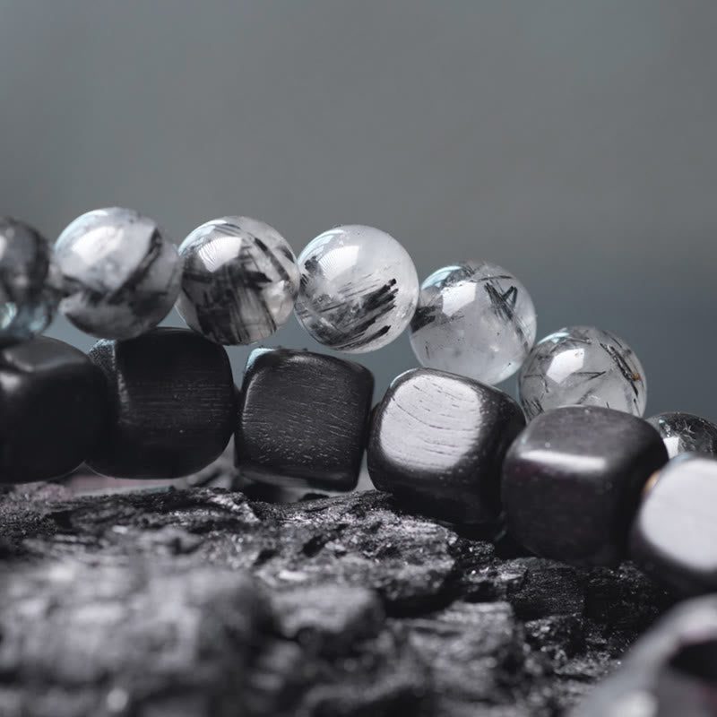 Braccialetto con bilanciere a doppio giro in ottone e rame, in legno di ebano e quarzo rutilato nero Buddha Stones