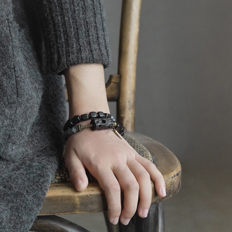 Braccialetto con bilanciere a doppio giro in ottone e rame, in legno di ebano e quarzo rutilato nero Buddha Stones